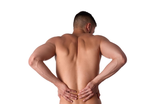 Young man with back pain The athlete clings to a sore back Man hurt his back Sports medicine concept