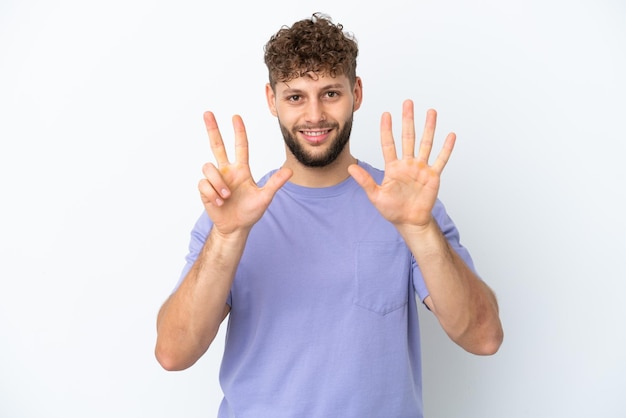 Young man with beard over isolated blue background with confuse face expression