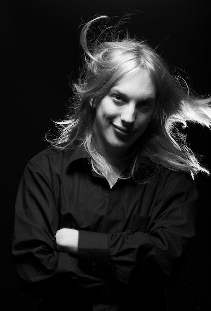 Young man with long blond hair