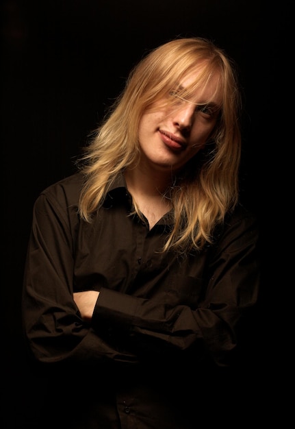 Young man with long blond hair