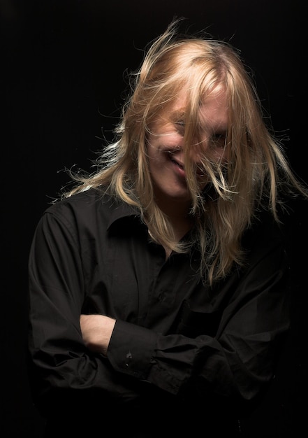 Young man with long blond hair