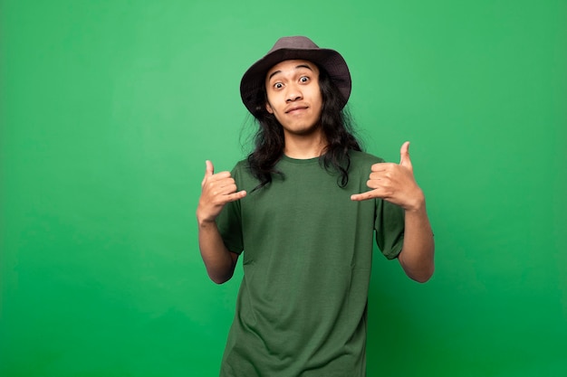 young man with long hair using green tshirt with joyful expression