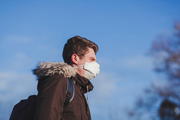 Young man with medical mask. Coronavirus protection