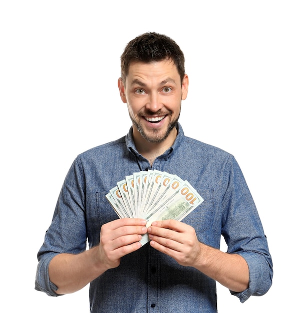 Young man with money on white background