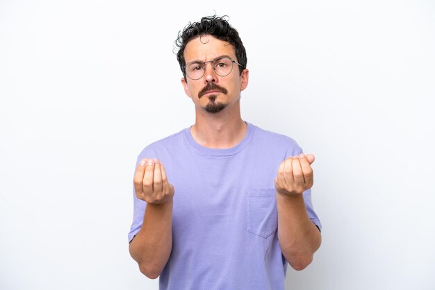 Young man with moustache isolated on white background making money gesture but is ruined