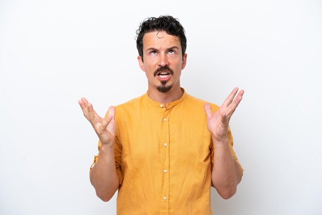 Young man with moustache isolated on white background stressed overwhelmed