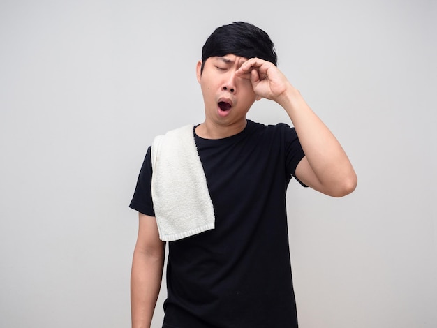 Young man with towel gesture yawn fells sleepless isolated