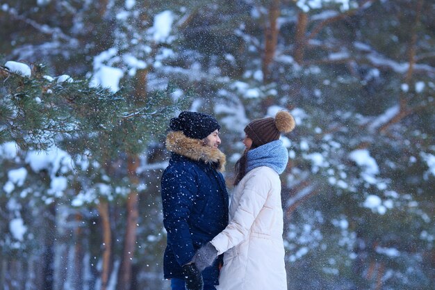 Young man and woman walking in cold weather