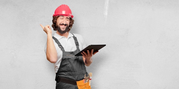 Young man worker with a tablet