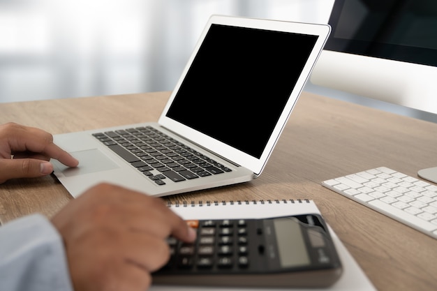 Young man working Businessman using a desktop computer of the blank screen