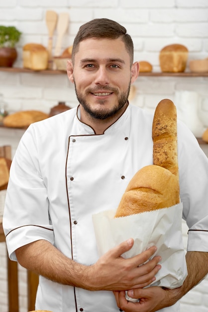 Young man working at his bakery