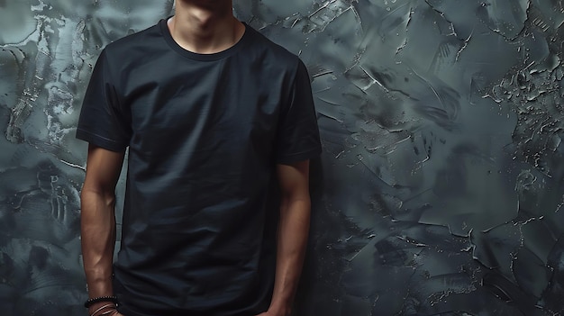 Young mans body in empty black tshirt on textured concrete wall background