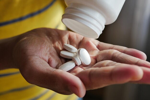 Young men taking medical pill