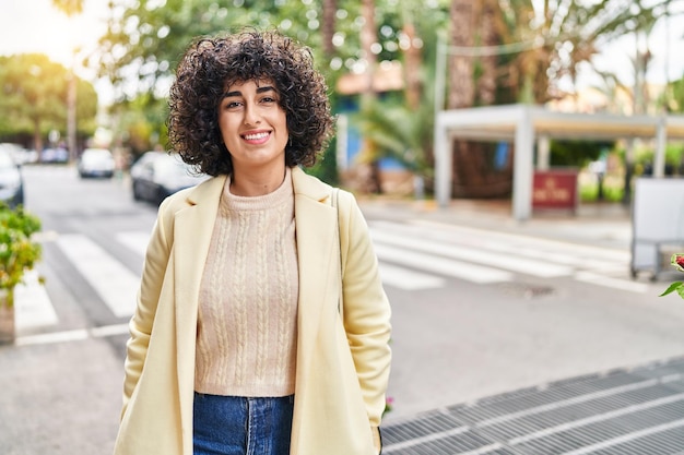 Young middle east woman excutive smiling confident standing at street