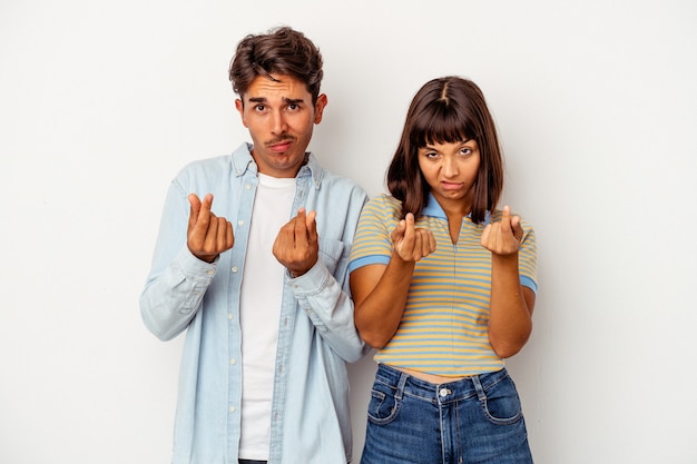 Young mixed race couple isolated on white background showing that she has no money.