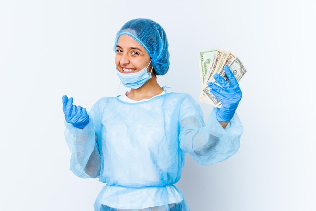 Young mixed race doctor woman holding dollars isolated on white