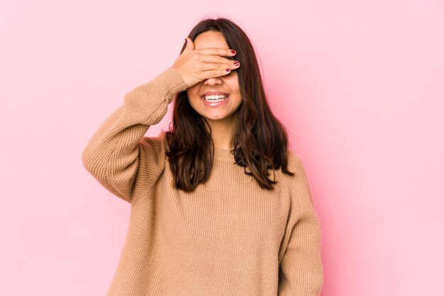 Young mixed race hispanic woman isolated covers eyes with hands