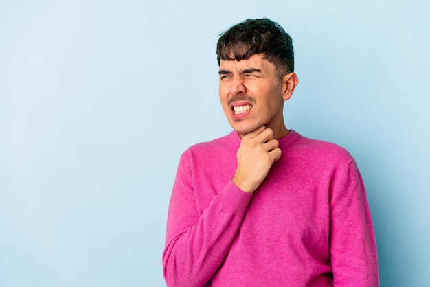 Young mixed race man isolated on blue background touching back of head, thinking and making a choice.