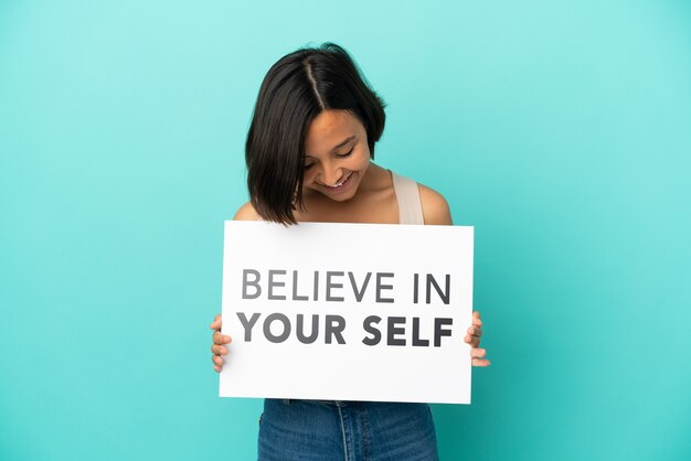 Young mixed race woman isolated holding We Want You board