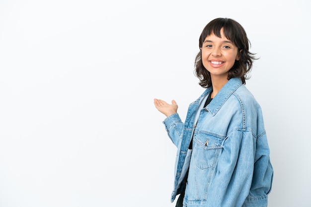 Young mixed race woman isolated on white background extending hands to the side for inviting to come