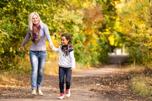 Young mother and her toddler girl have fun