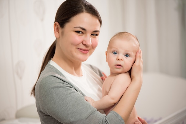 Young mother nursing her newborn child