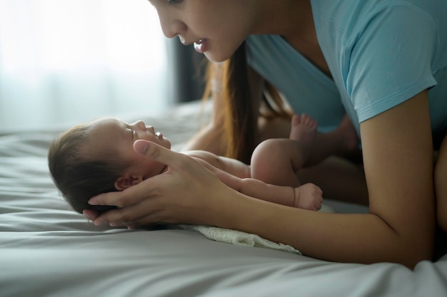 Young mother with a Cute new born baby