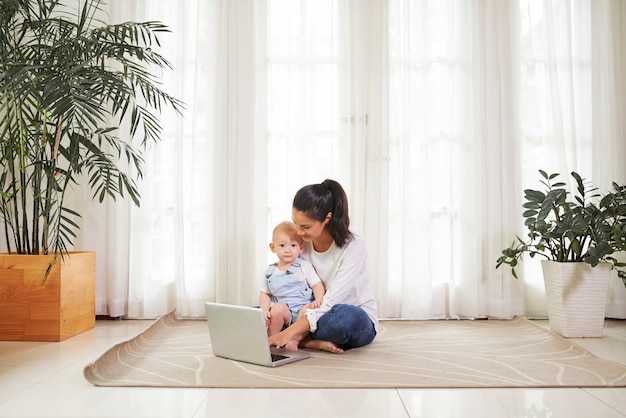 Young mother working from home