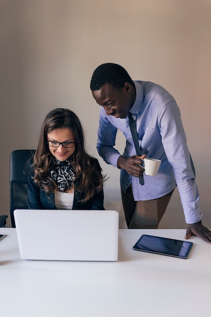 Young Multi-Ethnic Couple Working at the Office.