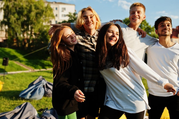 Young multi ethnic group of people in open air cinema.