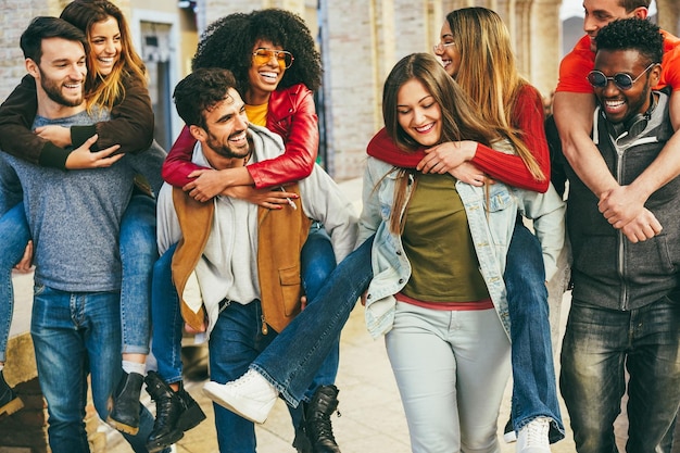 Young multiracial people having fun outdoor Focus on african man face