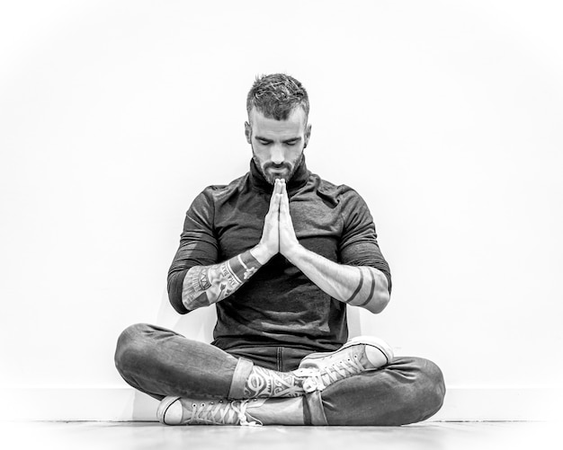 Young muscular caucasian man with arms crossed