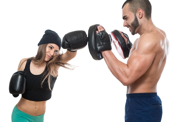 Young Muscular Couple In Gloves With A Naked Torso Boxing   Isolated On White Background