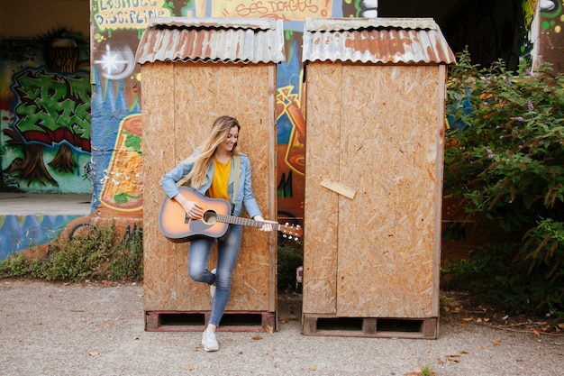 Young musician playing music on the street