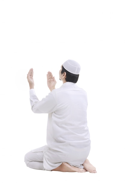 Young muslim man praying