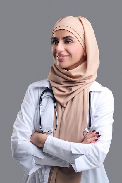 Young muslim woman in hijab looking contented and happy