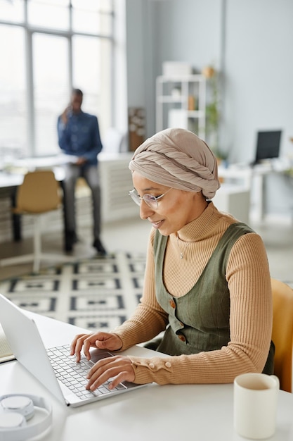 Young Muslim Woman in Office