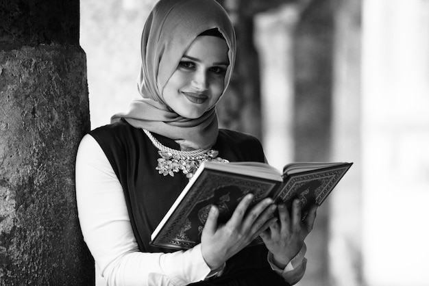 Young Muslim Woman Reading Holy Islamic Book Koran