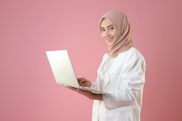 Young muslim woman work online on a laptop