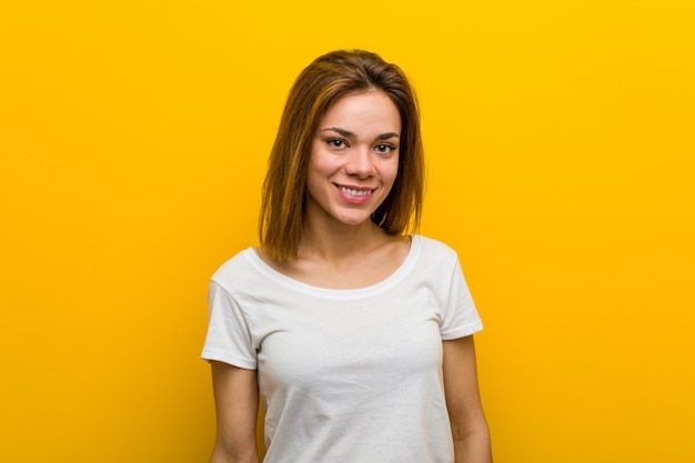 Young natural caucasian woman happy, smiling and cheerful.