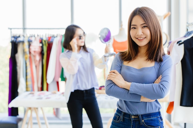 young new SME business owner happy and successful teen portrait with fashion clothing shop