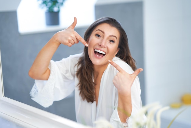 Young nice brunette woman in the bathroom High quality photo