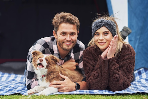 Young nice couple having fun on camping. High quality photo