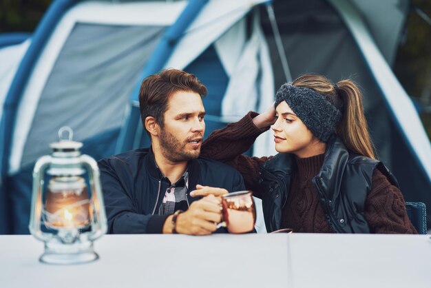 Young nice couple having fun on camping. High quality photo