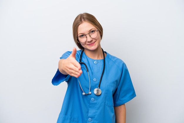 Young nurse doctor woman isolated on white background shaking hands for closing a good deal