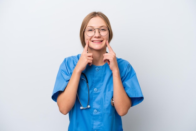 Young nurse doctor woman isolated on white background smiling with a happy and pleasant expression