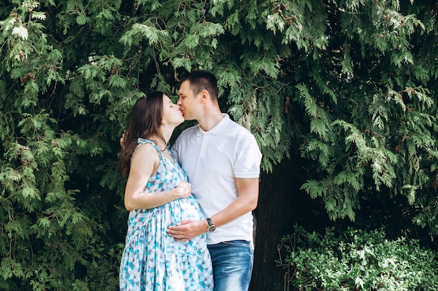 Young parents in the park on a warm spring day