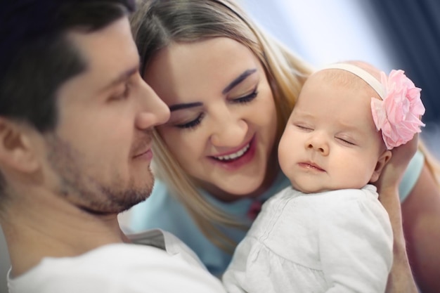 Young parents with baby at home