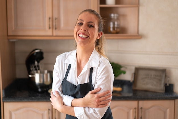 Young pastry chef cooking a sweet cake in the kitchen