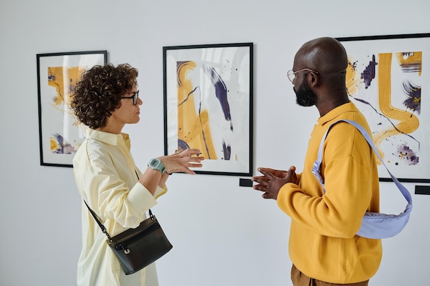 Young people discussing pictures together